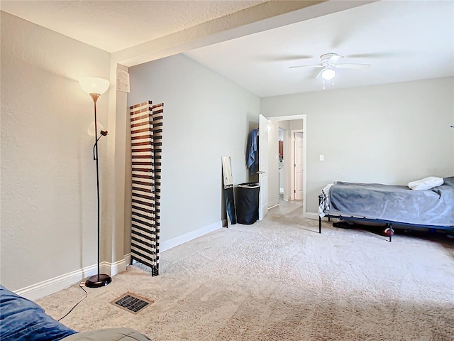 bedroom with light carpet and ceiling fan