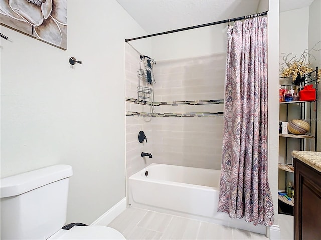 full bathroom with vanity, shower / tub combo, and toilet