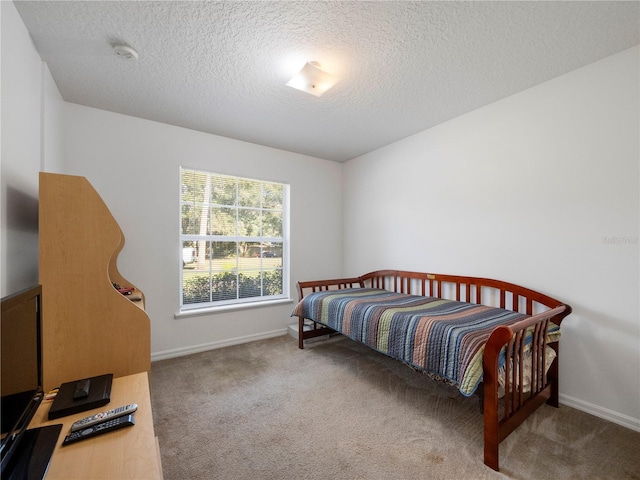 carpeted bedroom with a textured ceiling