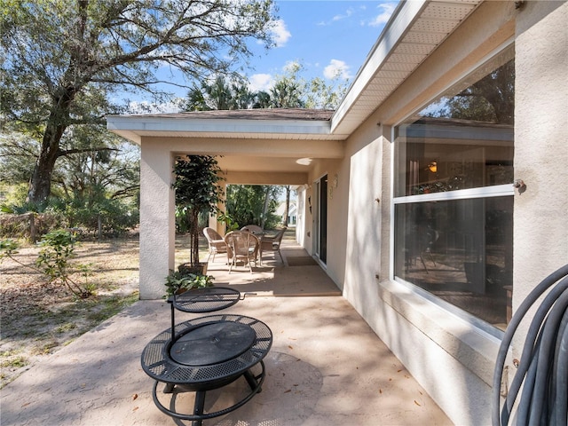 view of patio featuring an outdoor fire pit