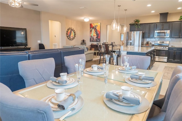 dining space featuring ceiling fan