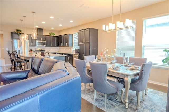 dining space with a notable chandelier