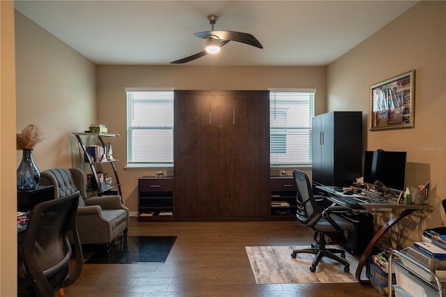 office space with wood-type flooring and ceiling fan