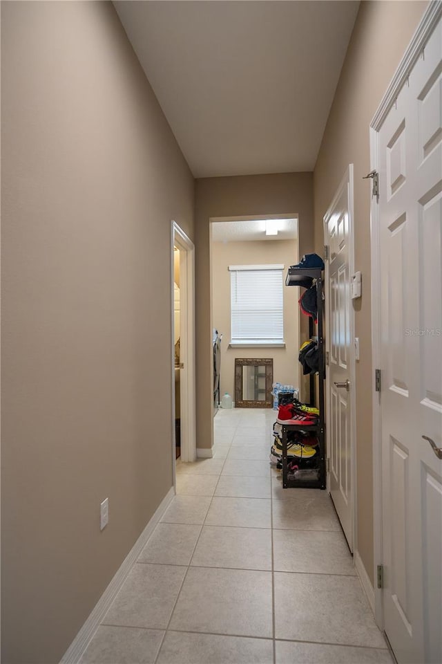 hallway featuring light tile patterned floors