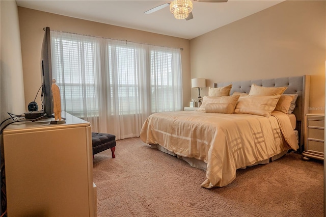 bedroom with ceiling fan and carpet flooring