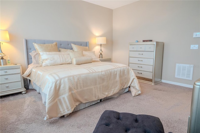 bedroom featuring light carpet