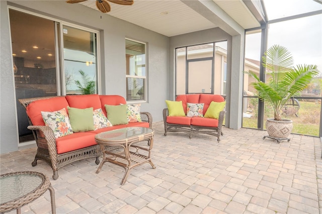 sunroom with ceiling fan and plenty of natural light