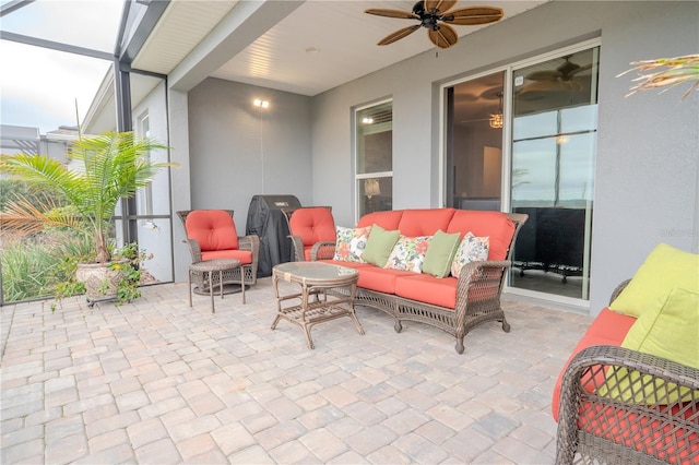 view of patio with ceiling fan, outdoor lounge area, and a lanai