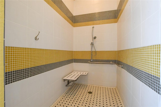 bathroom with tiled shower