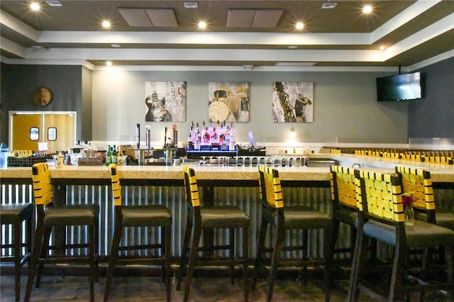 bar featuring a tray ceiling