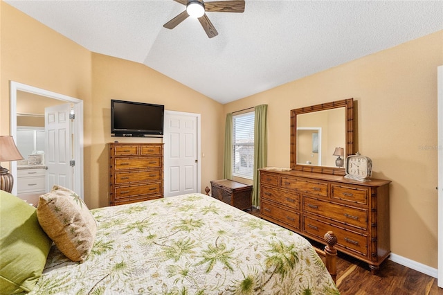 bedroom with ceiling fan, dark hardwood / wood-style flooring, vaulted ceiling, and a textured ceiling