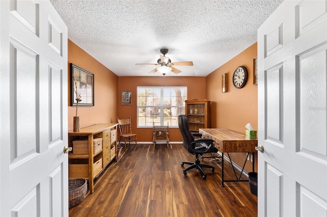 home office featuring dark wood-type flooring, ceiling fan, and a textured ceiling