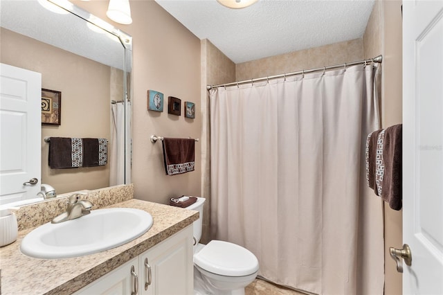 bathroom featuring vanity, walk in shower, a textured ceiling, and toilet