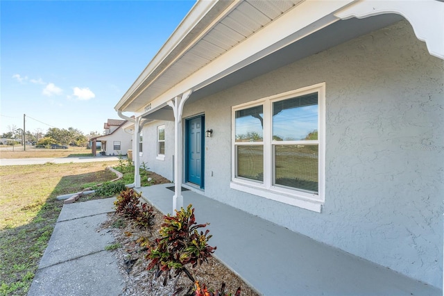 property entrance with a yard