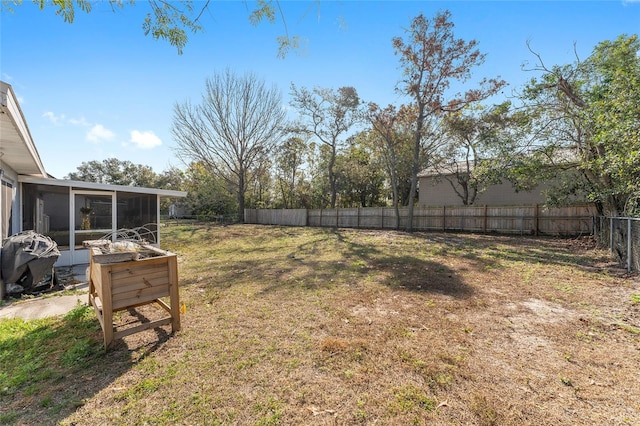 view of yard featuring a sunroom