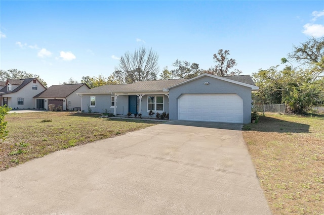 single story home with a garage and a front lawn