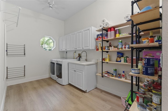 washroom with sink, cabinets, washer and clothes dryer, ceiling fan, and light wood-type flooring