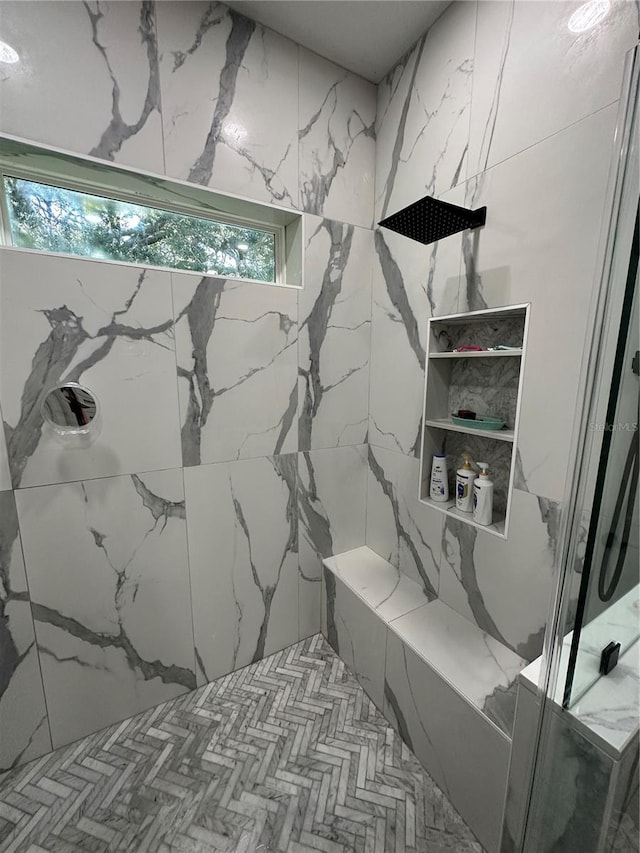 bathroom with a tile shower