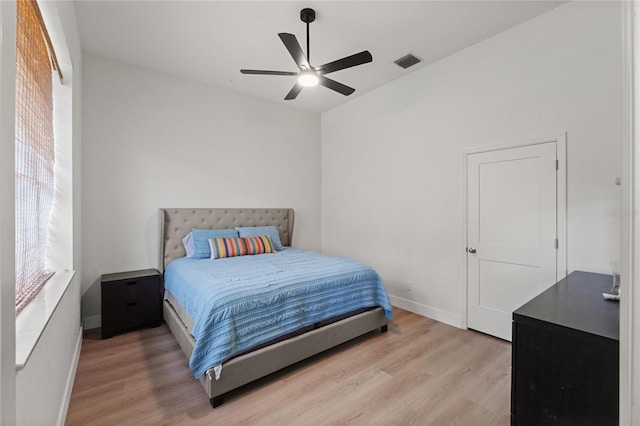 bedroom with ceiling fan and light wood-type flooring