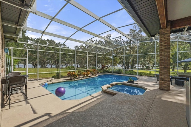 view of swimming pool with an in ground hot tub, a patio, and glass enclosure