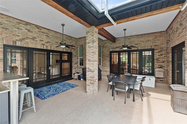 view of patio featuring french doors and ceiling fan