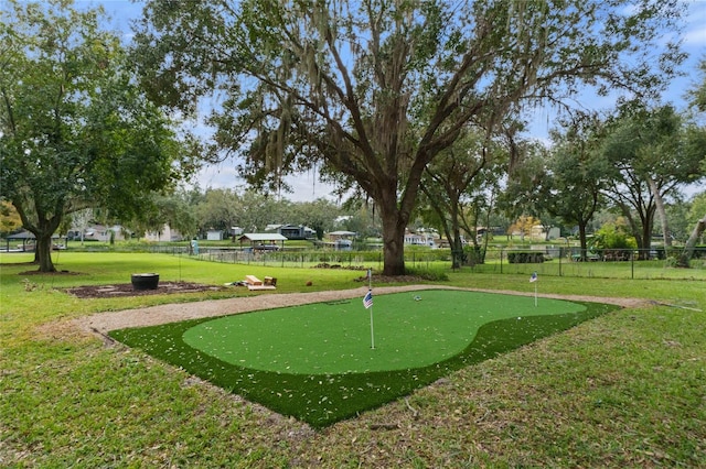 view of property's community with a lawn