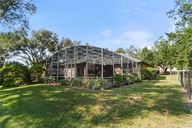 rear view of house featuring a yard