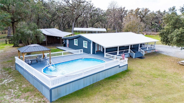 view of pool featuring a gazebo and a lawn