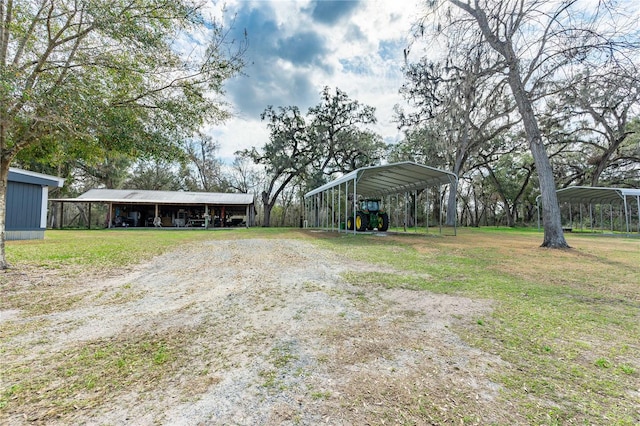 view of yard with a carport