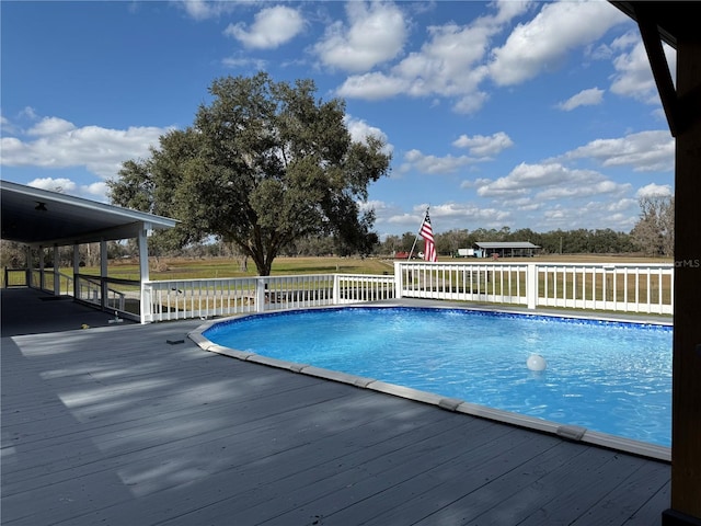 view of pool with a wooden deck