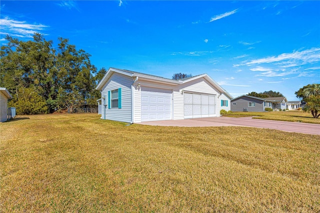 view of front of property with a garage and a front lawn