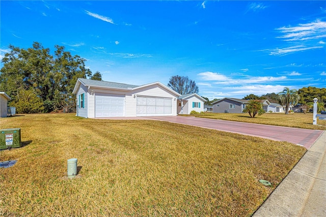 view of front facade with a garage and a front yard