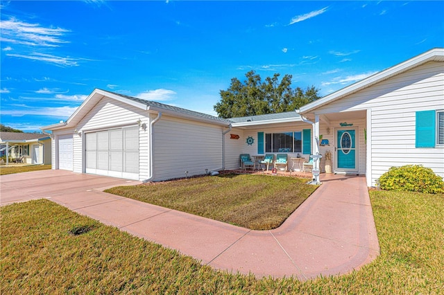 single story home with a garage, covered porch, and a front lawn