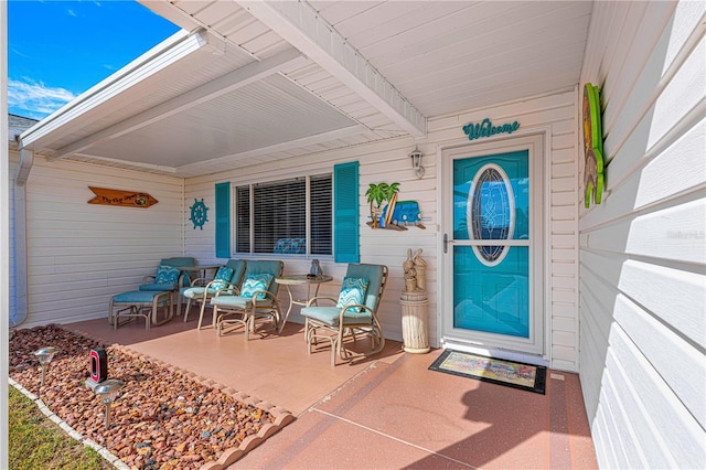 doorway to property with covered porch