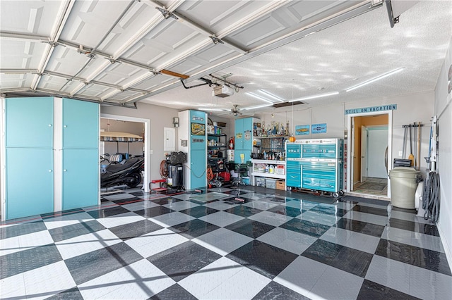 garage with a garage door opener and ceiling fan