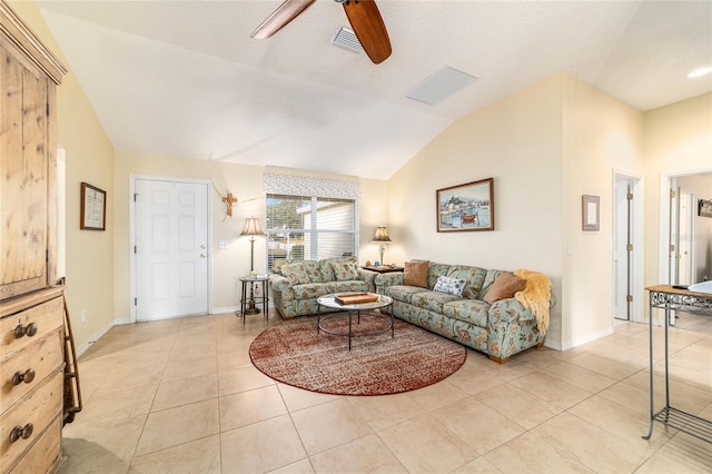 tiled living room with ceiling fan, lofted ceiling, and a textured ceiling