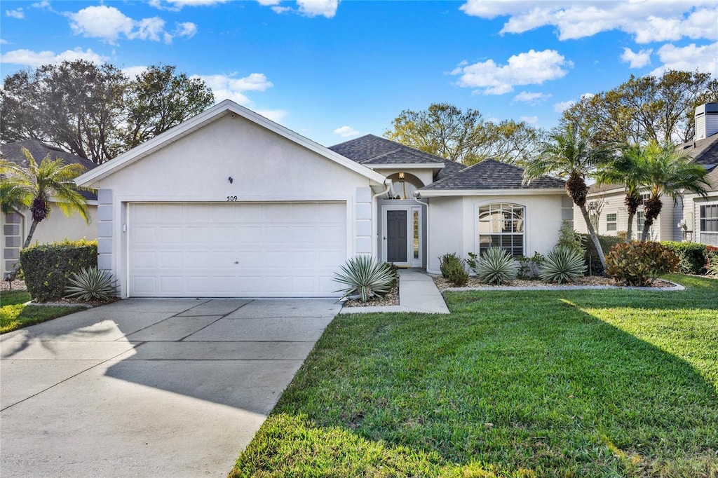 ranch-style house featuring a garage and a front yard