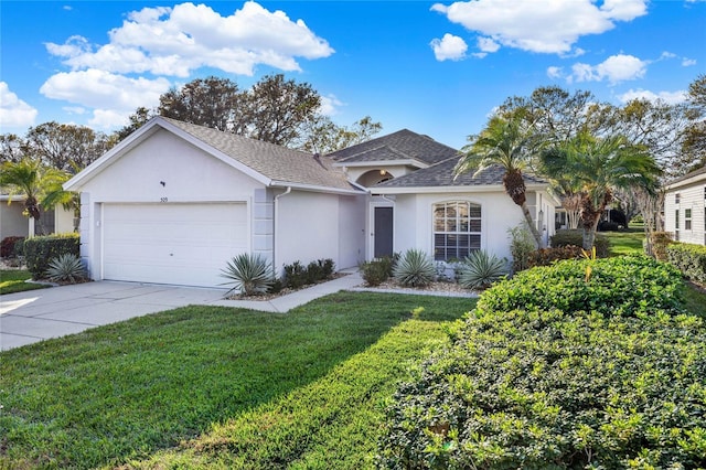 ranch-style home featuring a garage and a front yard