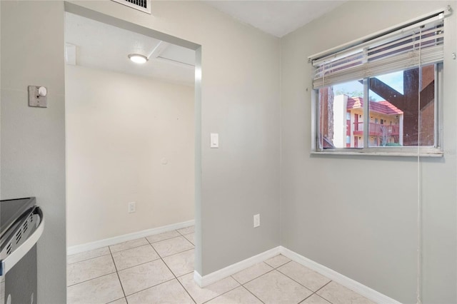 view of tiled spare room