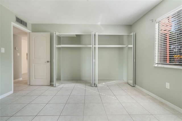 unfurnished bedroom featuring light tile patterned floors