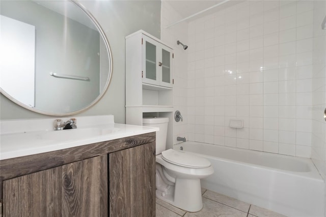 full bathroom with tiled shower / bath, vanity, toilet, and tile patterned flooring