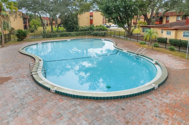 view of pool featuring a patio