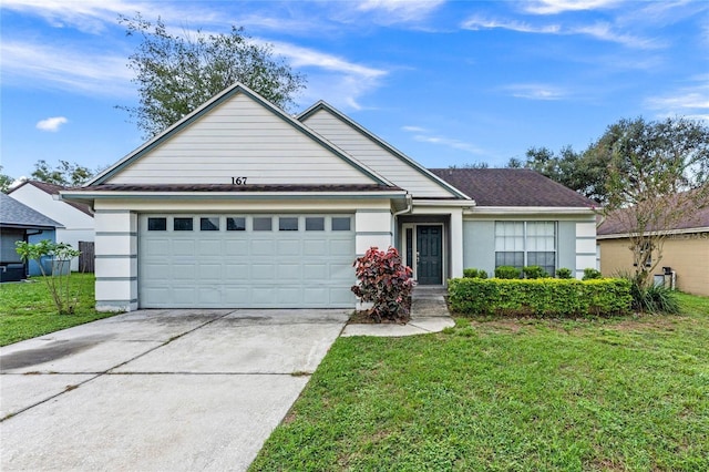 view of front of home featuring a garage and a front lawn