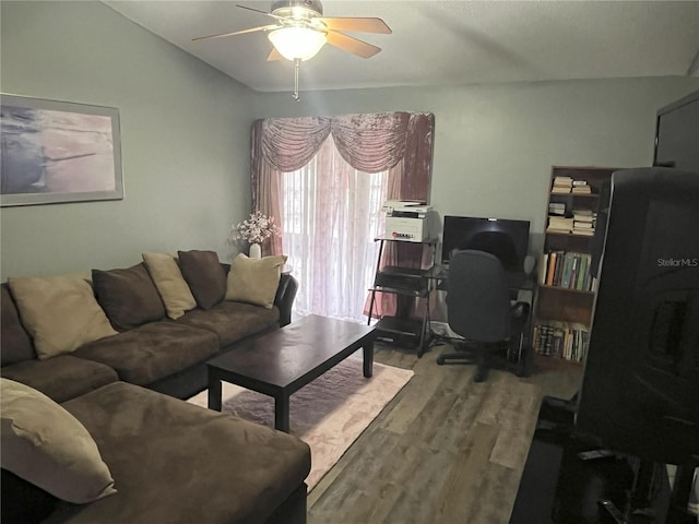 living room with hardwood / wood-style flooring and ceiling fan