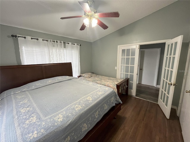 bedroom featuring lofted ceiling, dark hardwood / wood-style floors, ceiling fan, and french doors