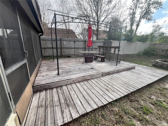 wooden deck with a fire pit