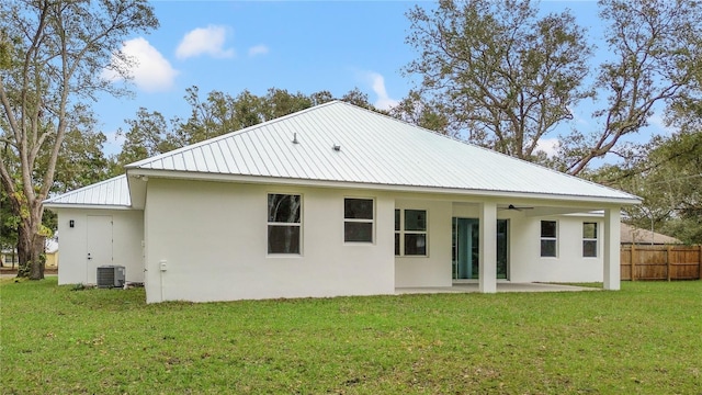 rear view of house featuring central AC, a patio area, ceiling fan, and a lawn