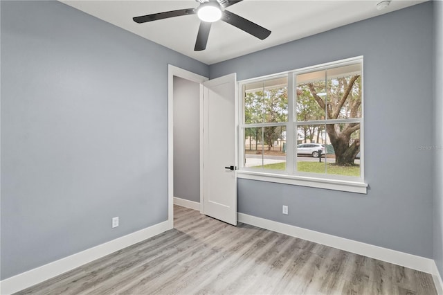 spare room featuring ceiling fan and light hardwood / wood-style flooring