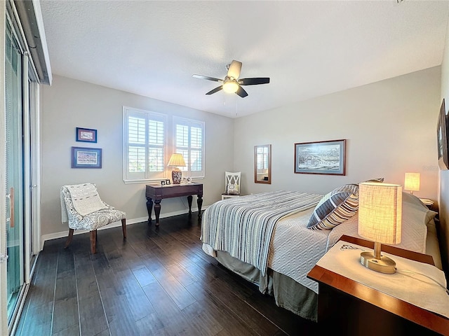 bedroom featuring ceiling fan and dark hardwood / wood-style floors