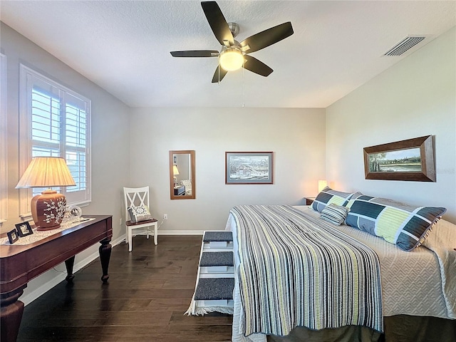 bedroom featuring dark hardwood / wood-style floors and ceiling fan